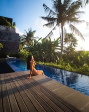 woman in swimming pool during daytime