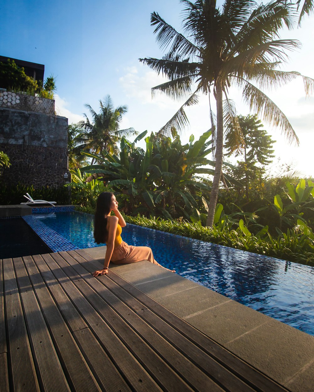 woman in swimming pool during daytime