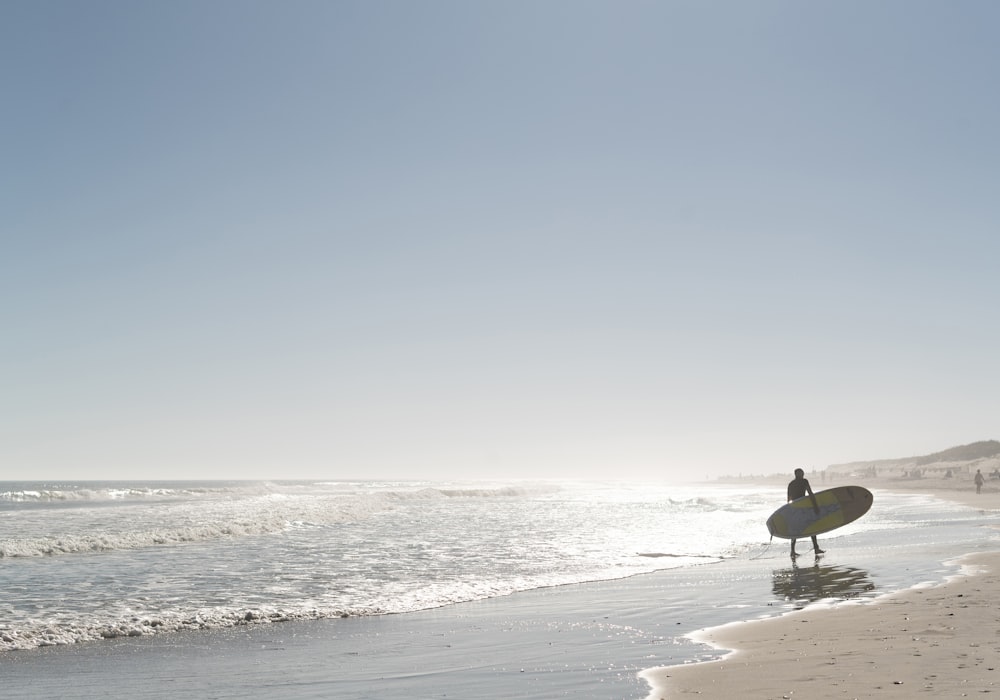 people walking on beach during daytime