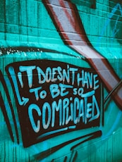 teal and white graffiti wall