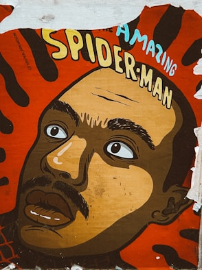 a painting of a man's face on a wall