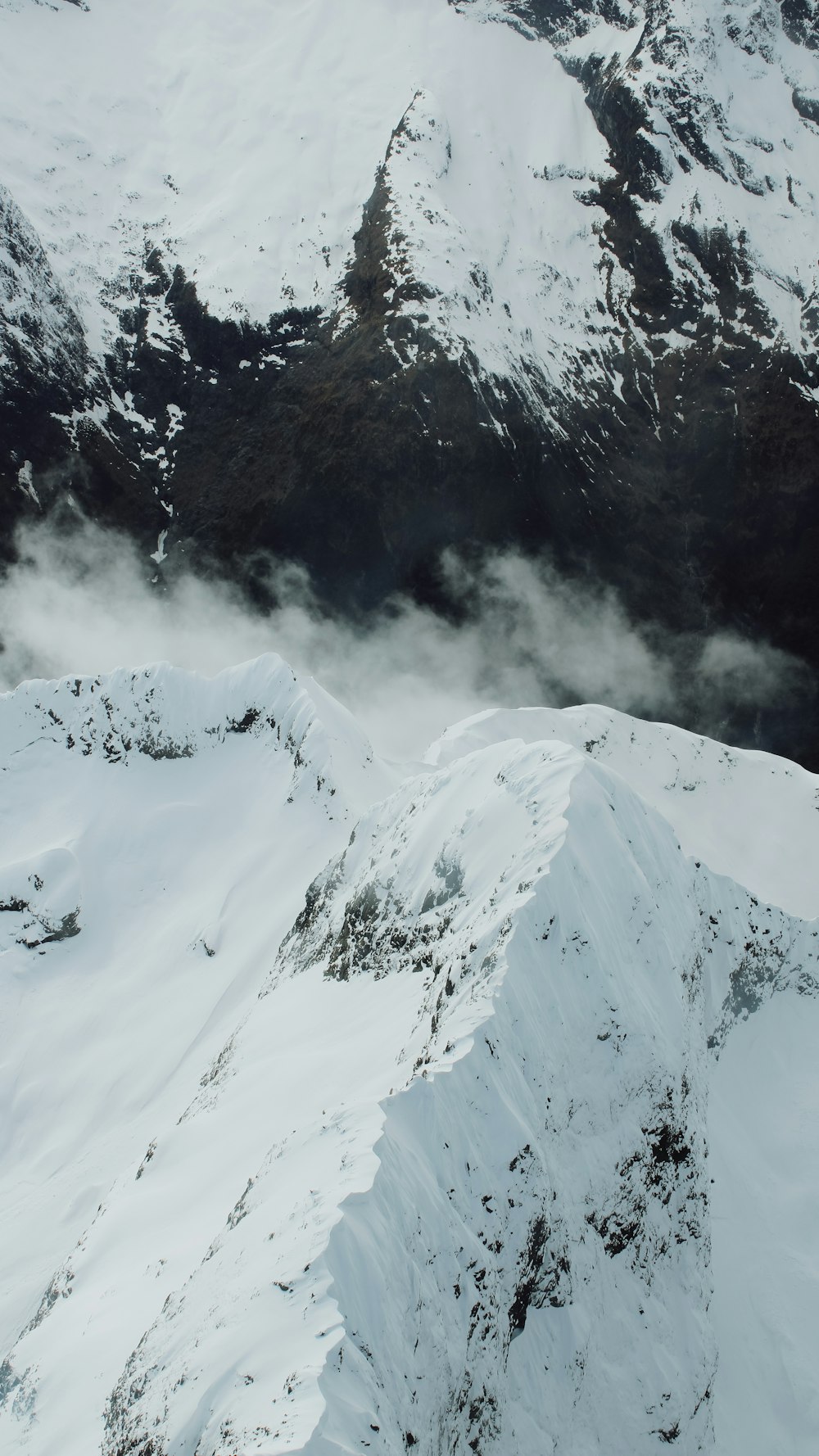 snow covered mountain during daytime