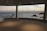 A happy guest enjoying the sea view from their room.