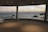A happy guest enjoying the sea view from their room.