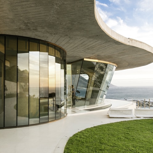 brown concrete building near sea during daytime