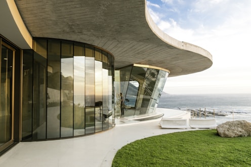 brown concrete building near sea during daytime