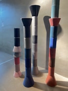 Abstract sculptures arranged in a bright gallery space.