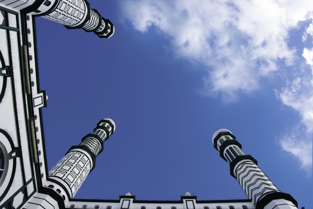 black and white striped street light under blue sky