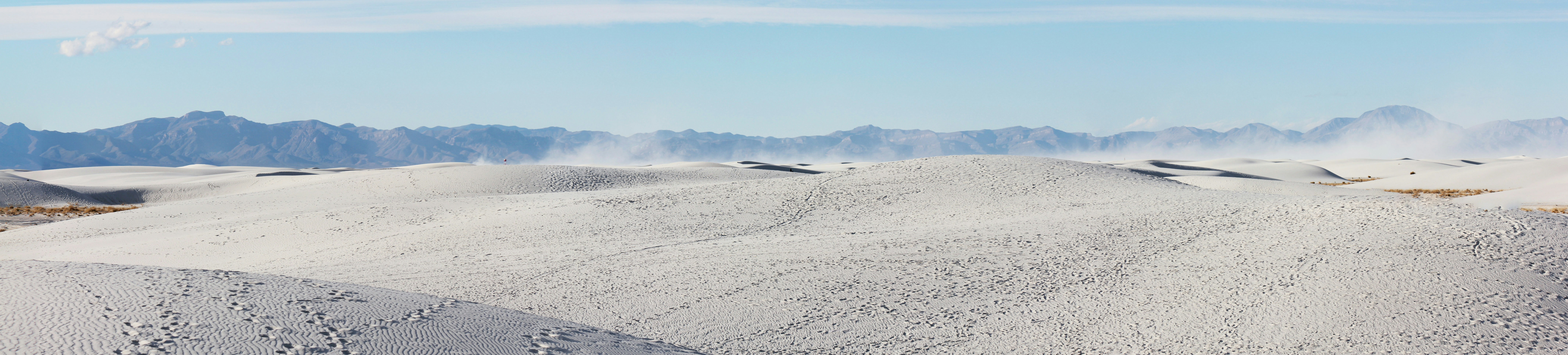 gray sand under blue sky during daytime