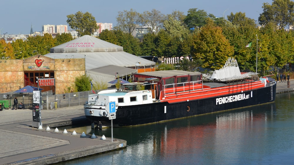 white and red boat on river during daytime