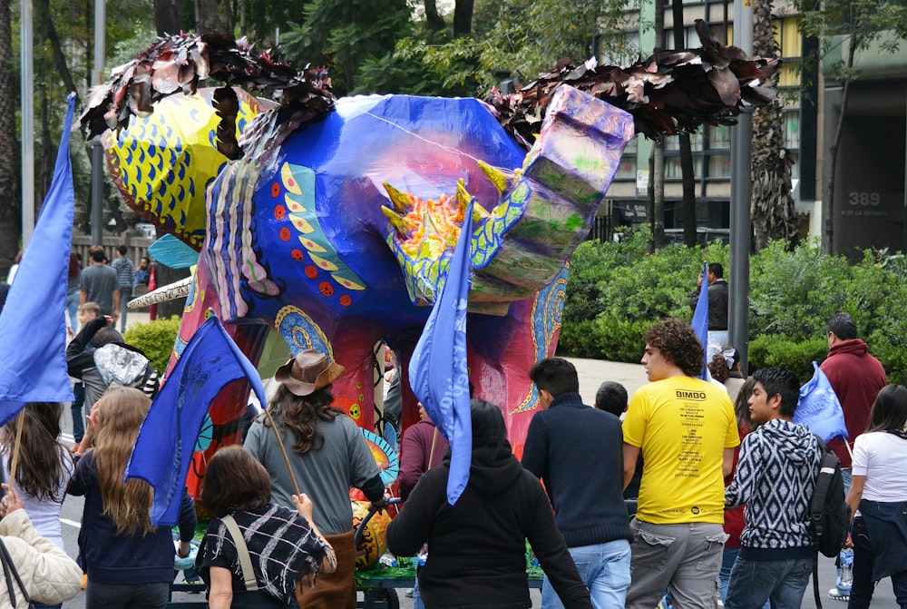 people gathering in a park with multi colored powder