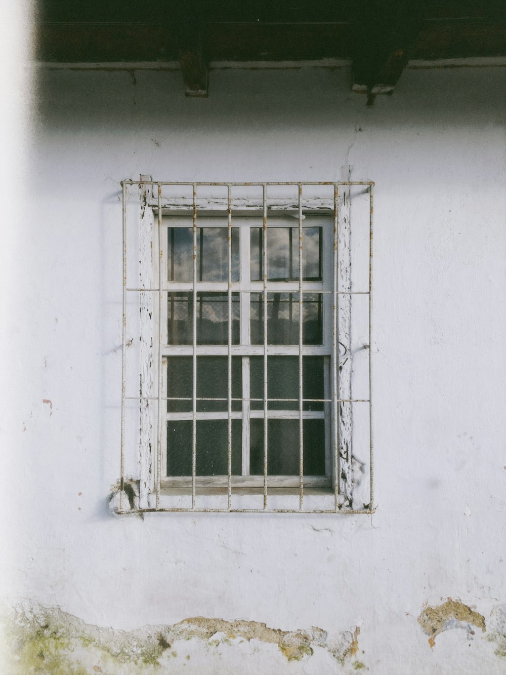 white wooden framed glass window