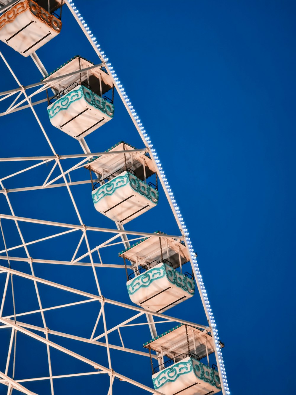 white and blue ferris wheel