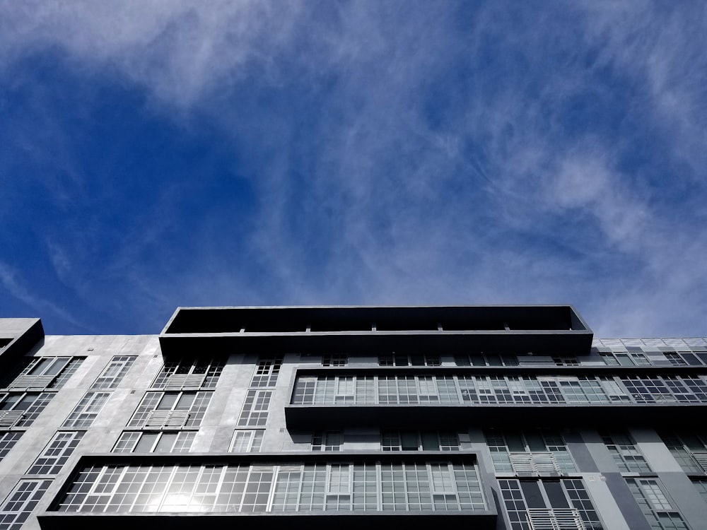 white and black concrete building under blue sky during daytime