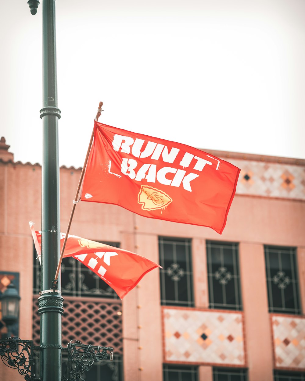 red and white flag on pole