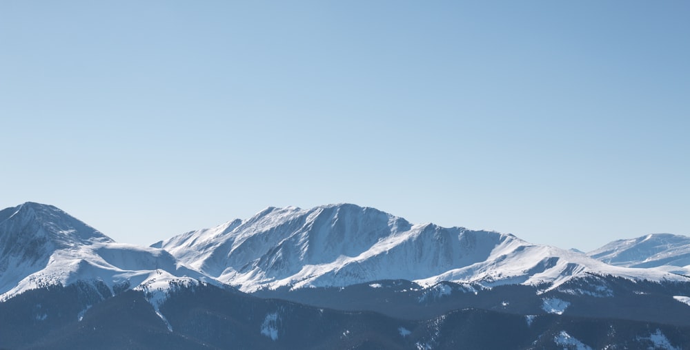 snow covered mountain under blue sky during daytime