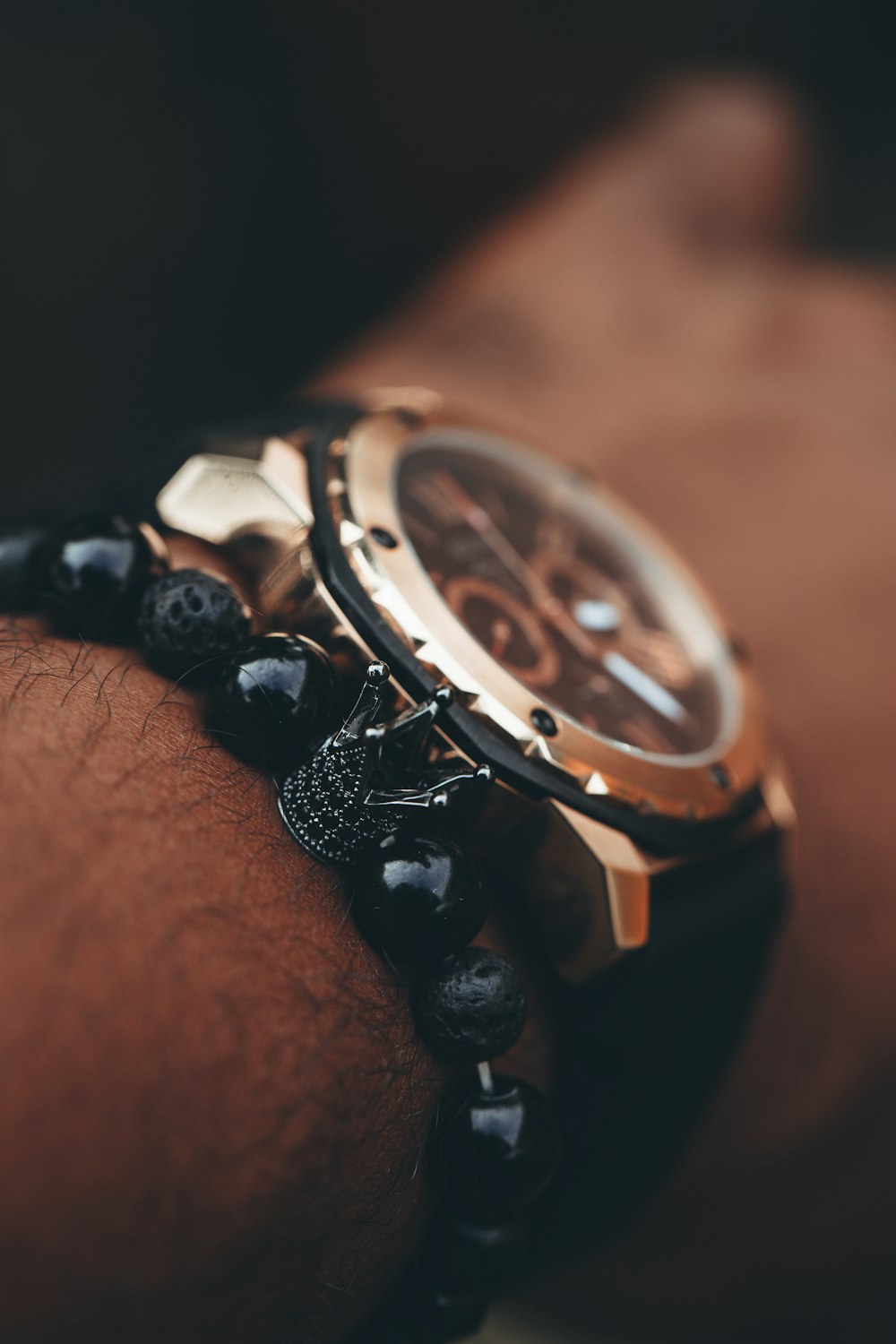 person wearing silver and black chronograph watch