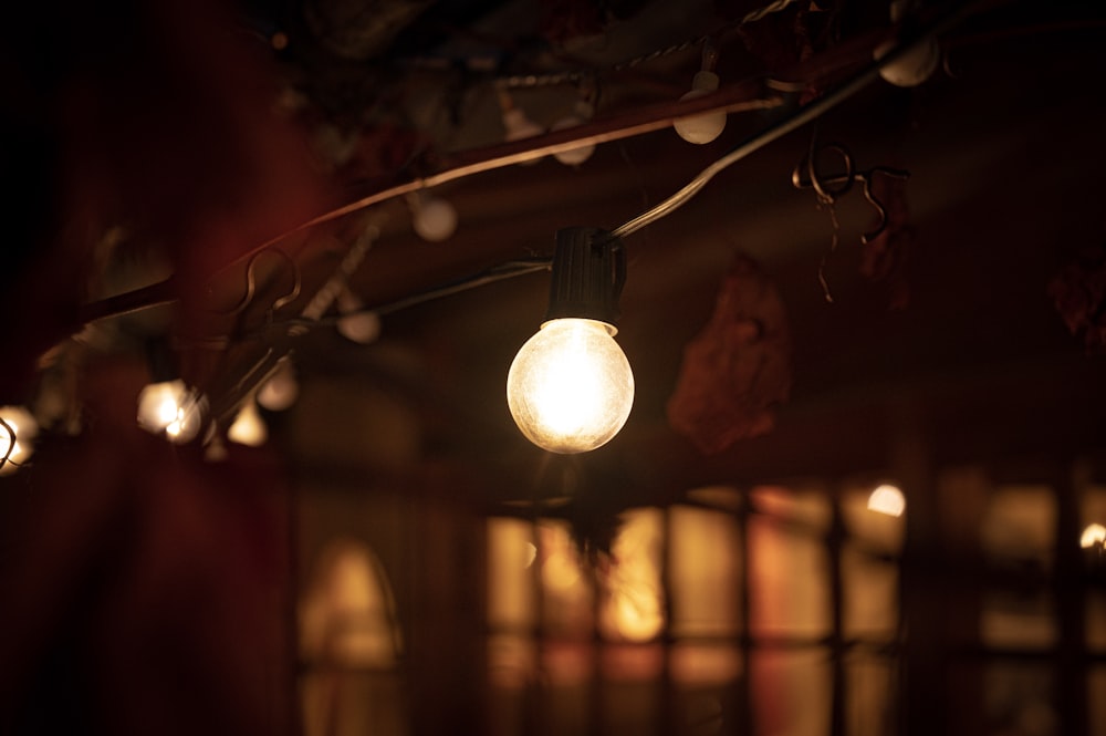 white pendant lamp turned on in room