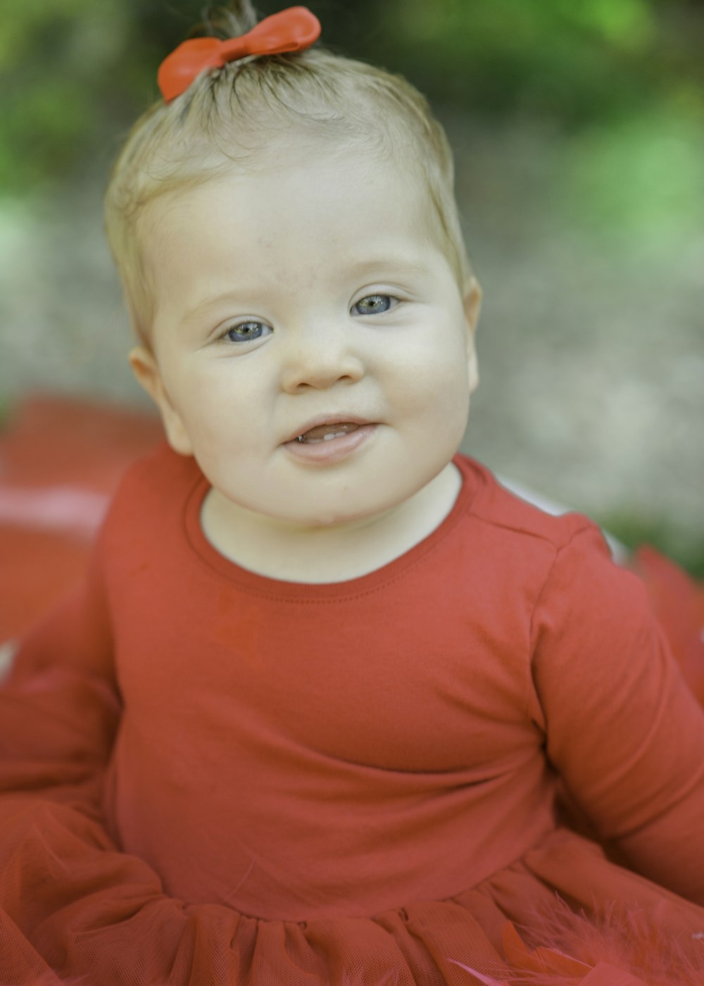 child in red long sleeve shirt