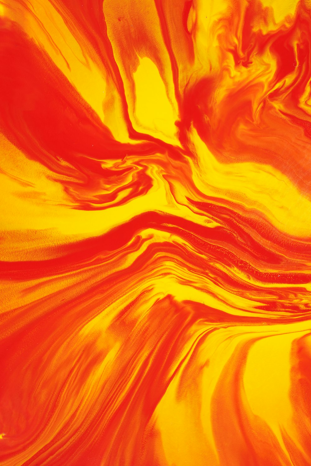 a close up of a yellow and red swirl