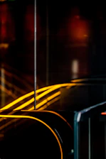 Dark, mysterious abstract neon-lit shapes evoking curiosity and intrigue.