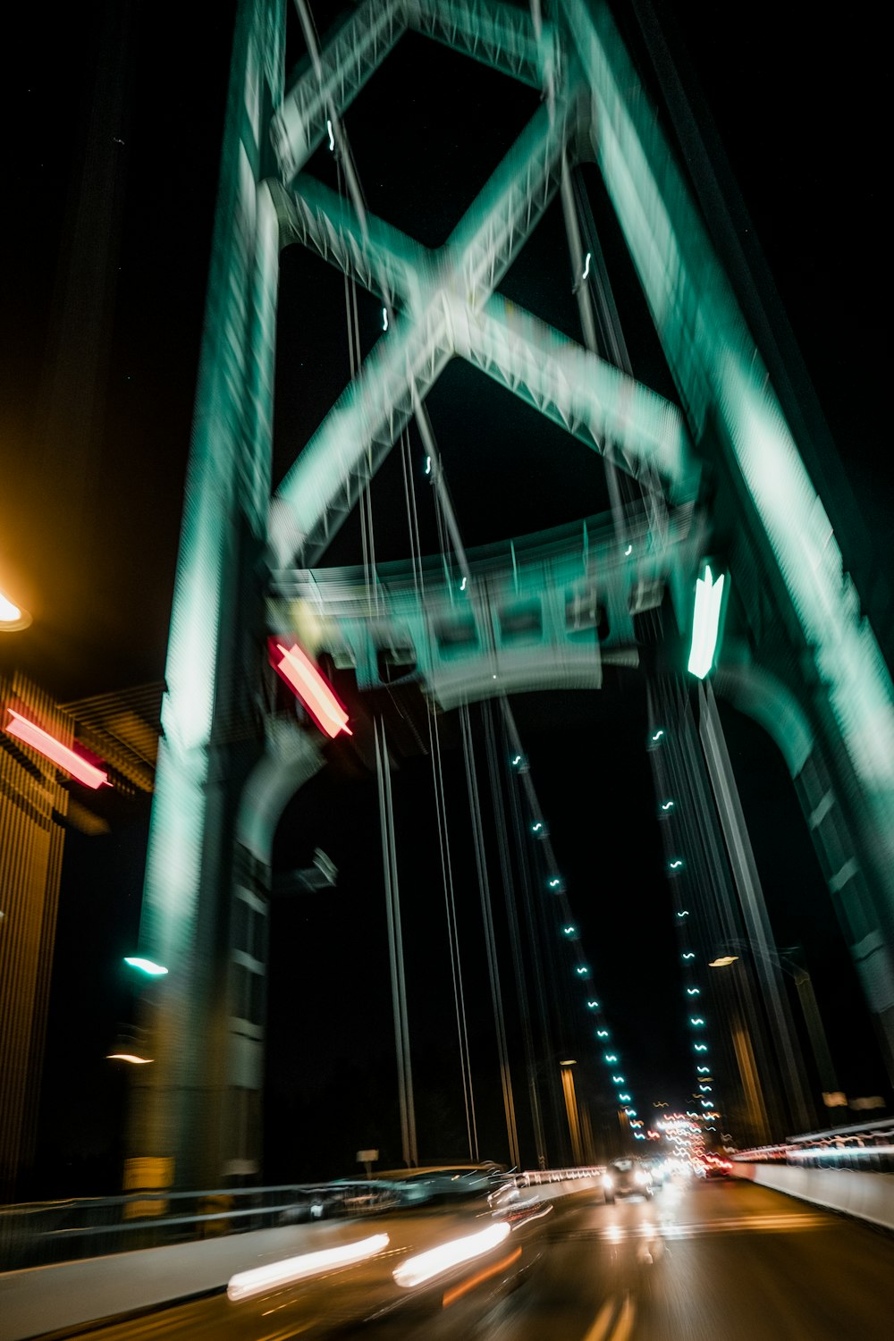 green and white bridge during night time