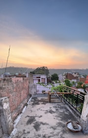 A rooftop with a beautiful view overlooking a residential area.