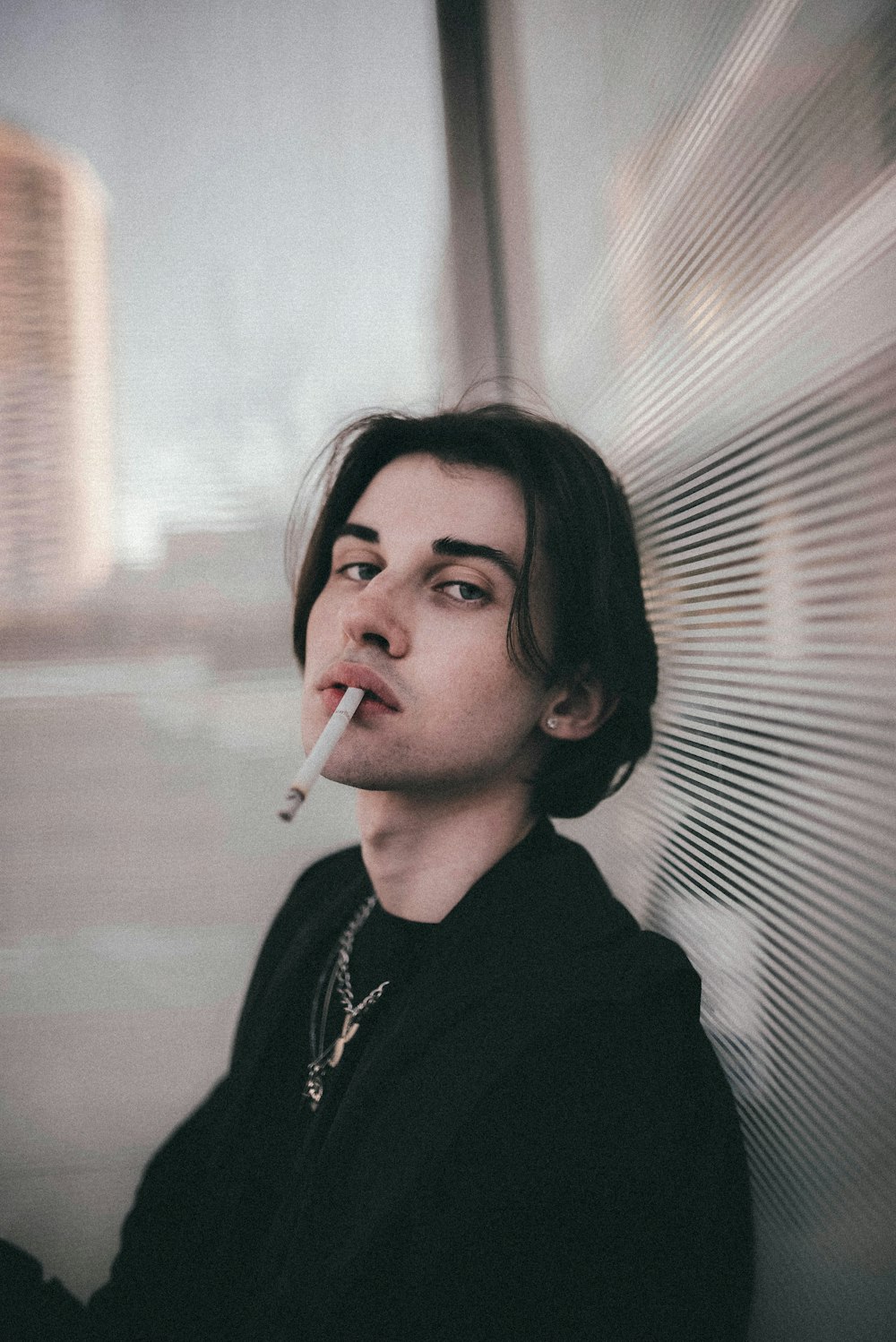 woman in black shirt smoking cigarette