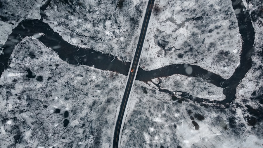 Car driving down a snow covered road