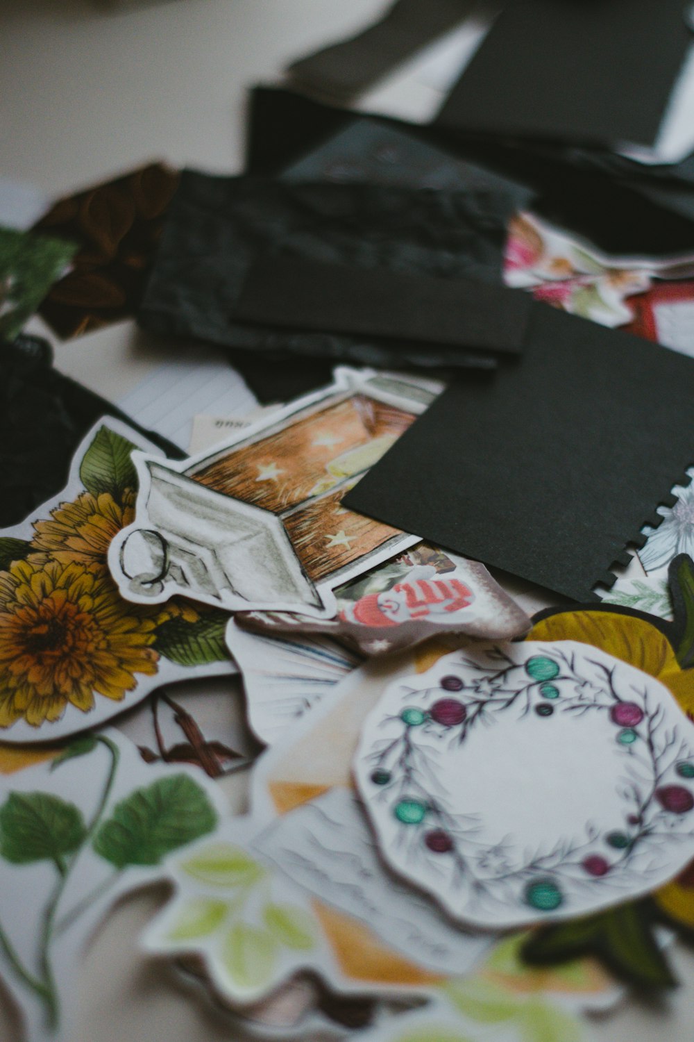 black leather bifold wallet on white and yellow floral textile