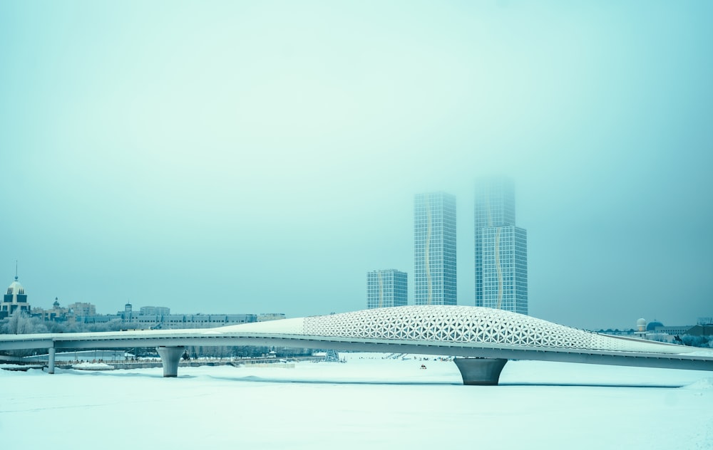 white and black bridge over body of water during daytime