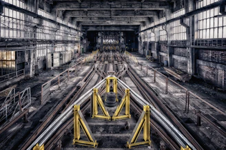 train rail in the middle of a tunnel