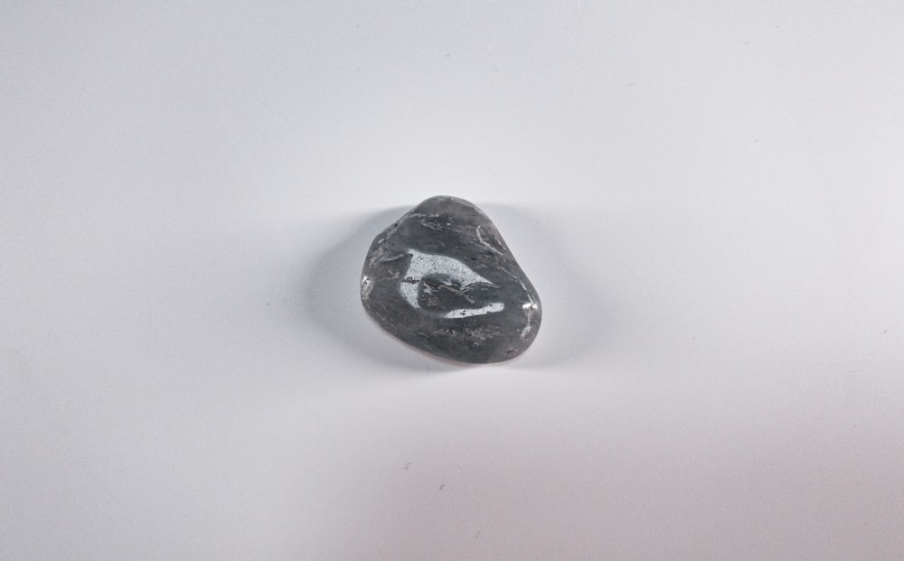 black stone on white table