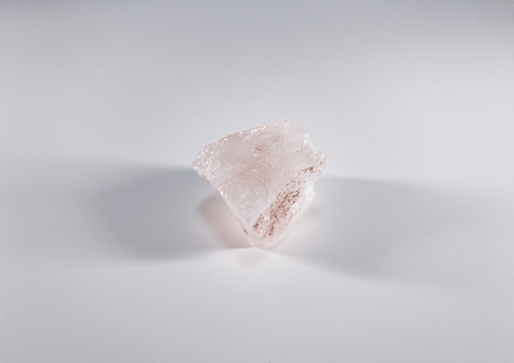 white stone on white table