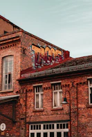 Happy customers enjoying tacos with vibrant street art in the background