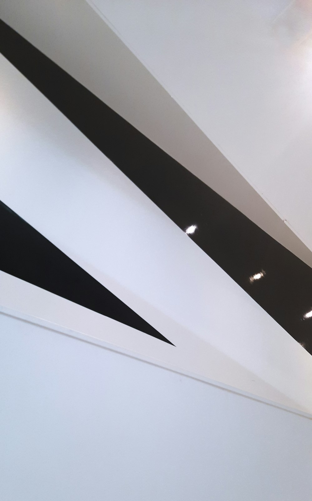 white and black ceiling with light fixture