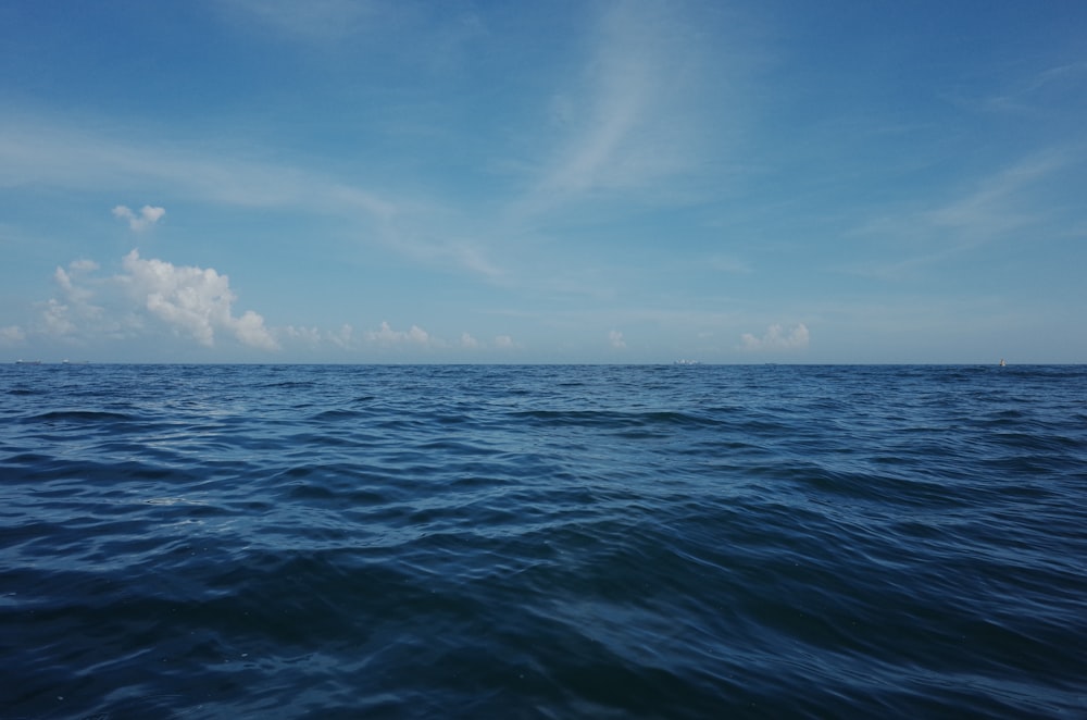 blue ocean under blue sky during daytime