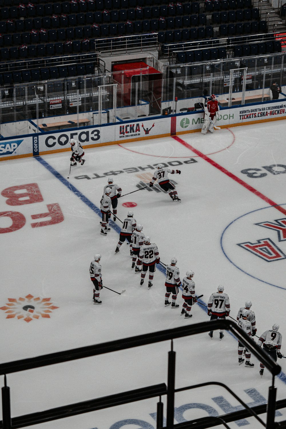 people playing ice hockey on ice field