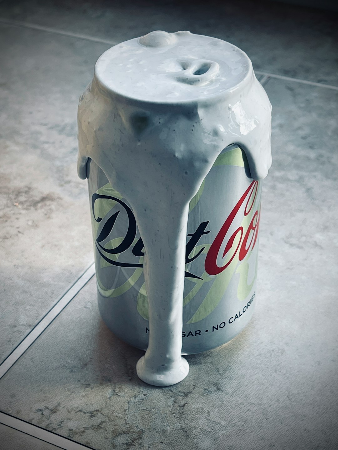 diet pepsi can on white ceramic tile