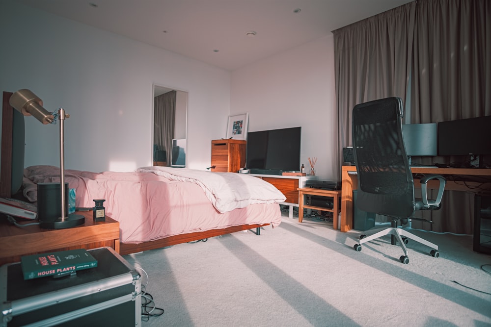 black flat screen tv on brown wooden tv rack