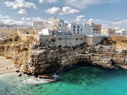 white concrete building near body of water during daytime