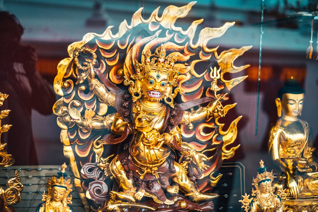 gold dragon figurine on black table