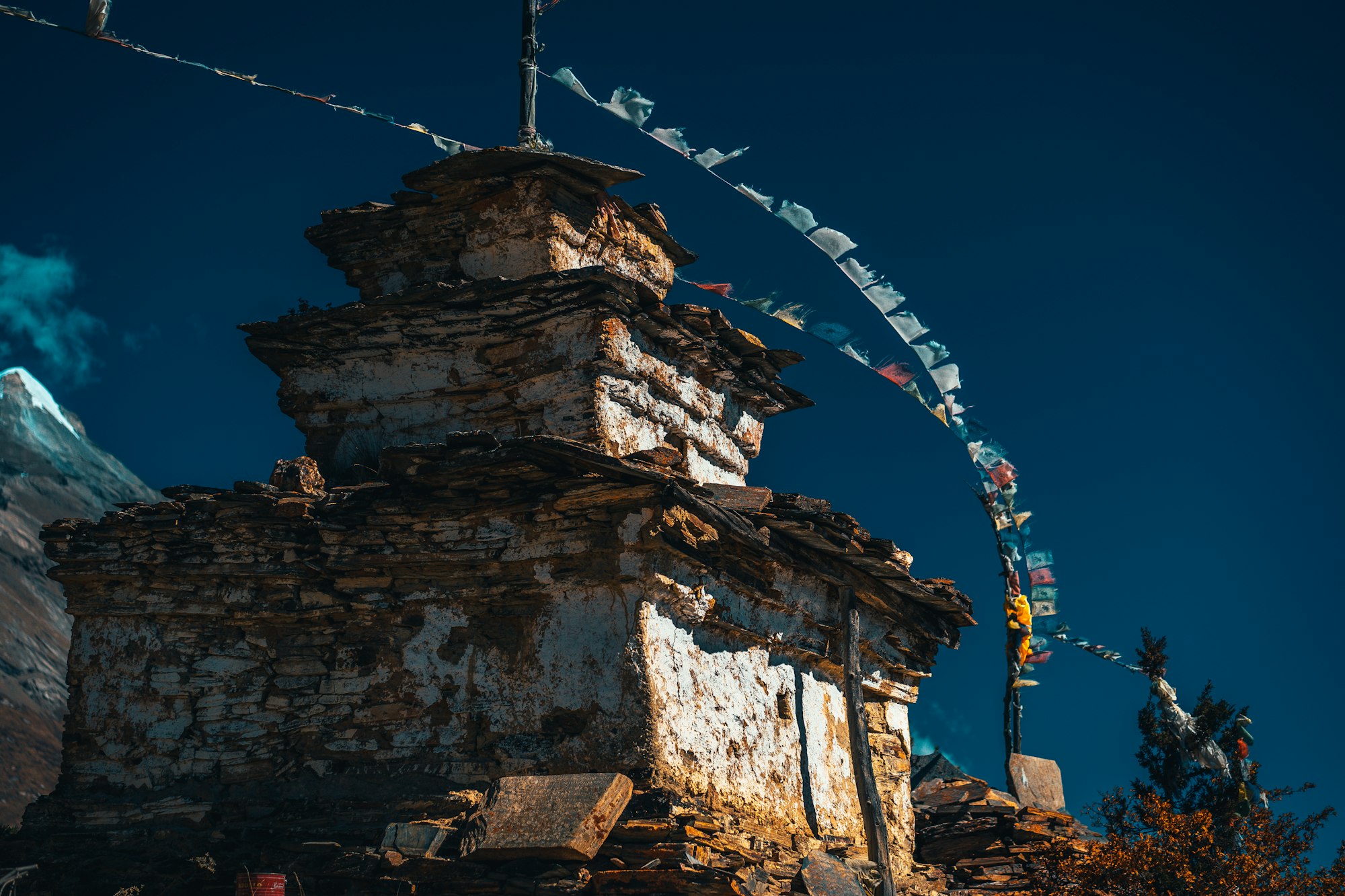 Buddhist stupa and lungta prayer flags in the Himalaya mountains, Annapurna region, Nepal