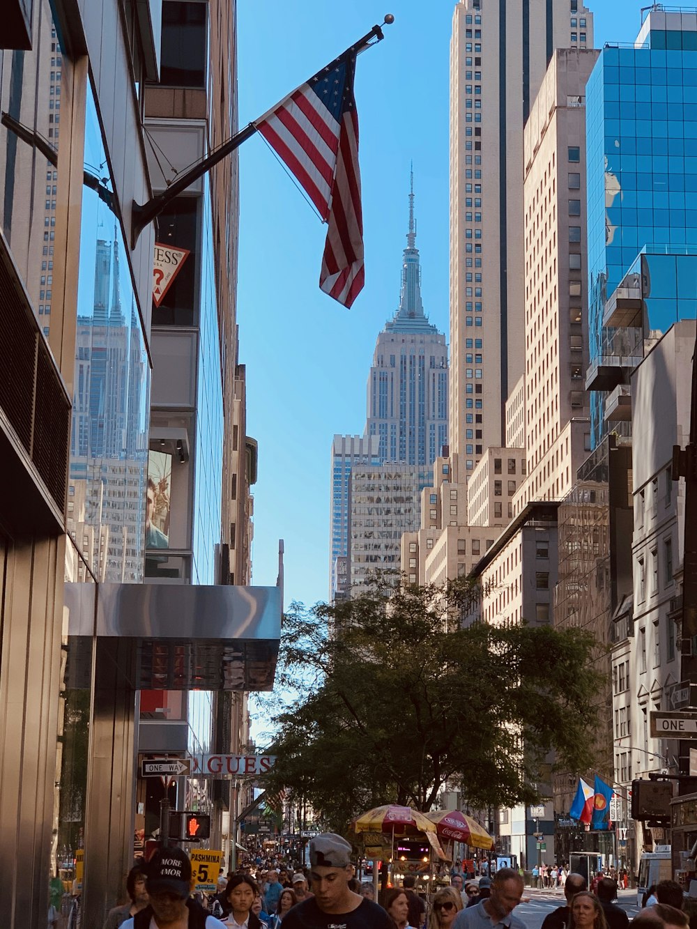 white and blue flag on gray metal pole