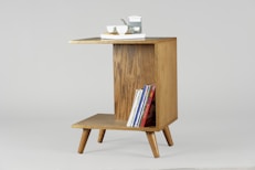 brown wooden table with books and mugs