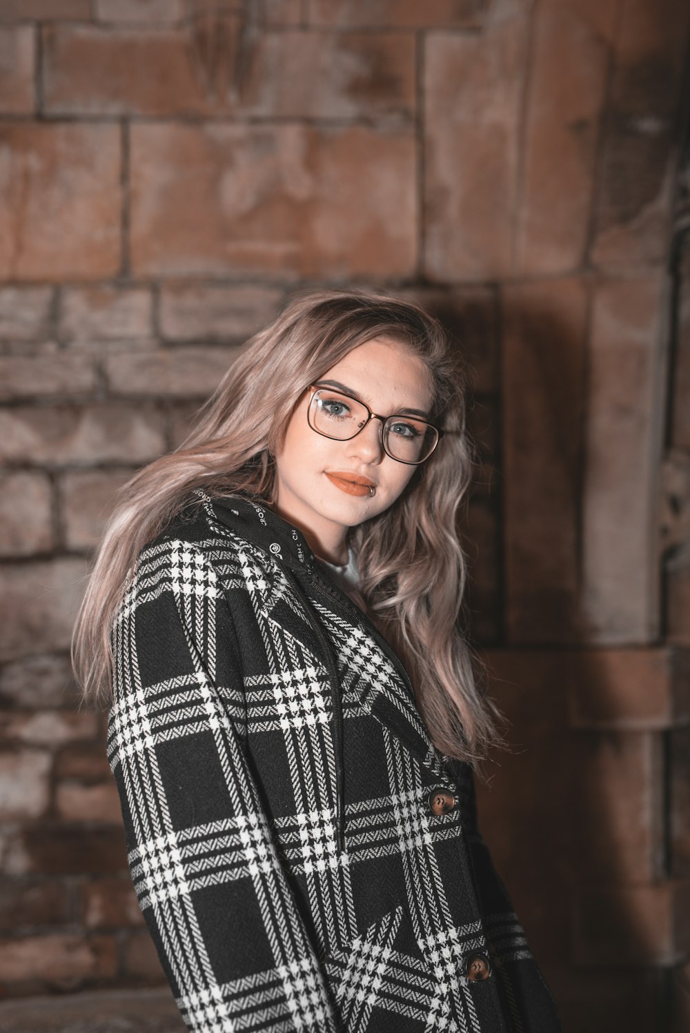 woman in black and white plaid long sleeve shirt wearing eyeglasses