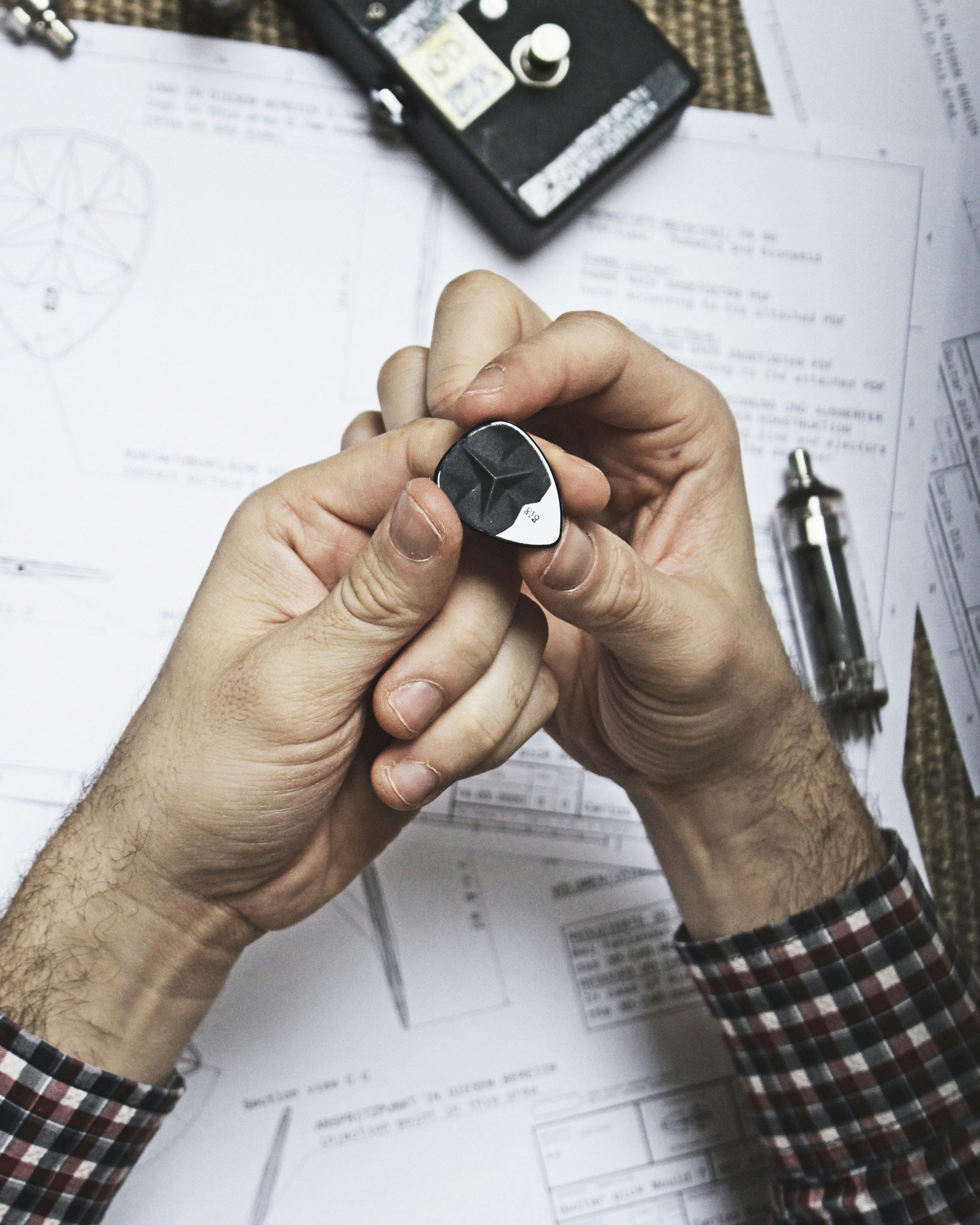 person holding black and white heart shape ornament
