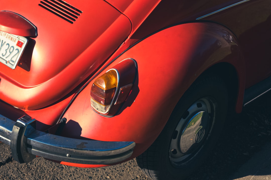 red car with silver and black round door