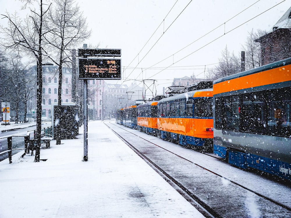 red and black train on rail tracks during daytime