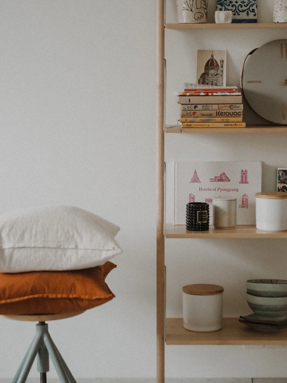 White ceramic bowl on wooden shelf